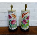 A pair of Chinese Famille Rose porcelain table lamp bases painted with flowers and birds on