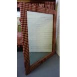 A contemporary rectangular wall mirror with red chequered woollen fabric surround, 148 x 125cm