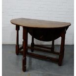 An oak gateleg table, 74 x 110cm