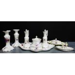 A continental porcelain 'Violets' floral patterned dressing table set, comprising jars, ring tray,