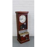 A mahogany cased Blick clocking in machine, 98 x 36cm