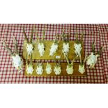 Two sets of vintage deer antlers on oak plinths together with two scull and antler wall plaques, (