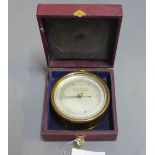 A Negretti & Zambra aneroid barometer Mark I, London 18329, contained within a leather fitted case,
