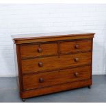 A Victorian mahogany chest, the rectangular top with canted edges over two short and two long