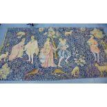 A wall hanging tapestry depicting figures against a foliate ground, 280 x 140cm