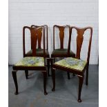 A set of four mahogany Queen Anne style splat back dining chairs on cabriole supports with slip in