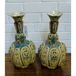 A pair of Zsolnay Pecs reticulated and lobbed bottle neck vases (restored and with damages) 38cm