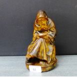 A French figure of a seated Monk, 19cm high