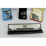A quantity of vintage paste and marcasite jewellery to include a bracelet, brooches, earrings, clips