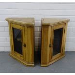 Two small oak corner cabinets, with glazed doors and shelved interior, 51 x 49cm (2)