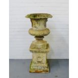 A stone garden campana urn and plinth base, 110cm