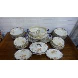 A 19th century Staffordshire floral patterned dinner service comprising tureens, oval serving