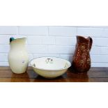 A Portmeirion brown glazed leaf moulded jug, a clover leaf bowl and an enamel jug (3)
