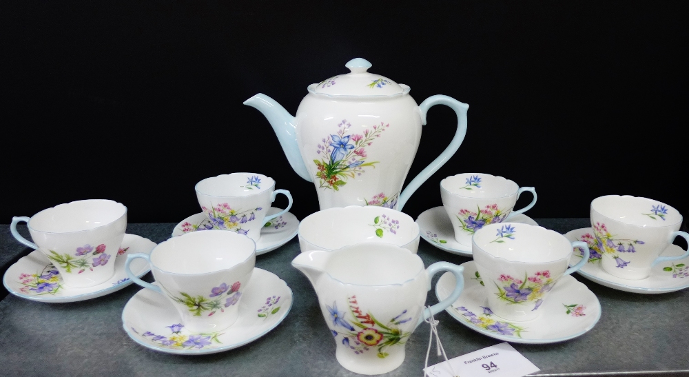 A Shelley porcelain 'Wild Flowers' patterned tea set comprising teapot, milk jug, sugar bowl, six