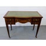 An Edwardian rosewood and marquetry inlaid writing desk, the rectangular top with inset green