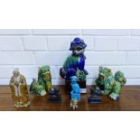 A small collection of Chinese temple dogs and a figure (8)