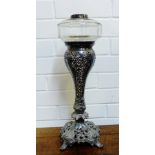 An Epns oil lamp base with a clear glass well, 47cm high