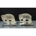 A pair of opaque glass elephants on clear glass rectangular plinth bases, 14 x 12cm (2)