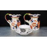 A pair of Ironstone Imari patterned jugs with serpent handles together with a bat print cup and