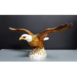 A Beswick 'Bald Eagle' numbered 1018, 17 x 34cm