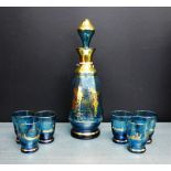 A blue glass and gilt decorated decanter and set of six shot glasses (6)