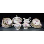 A 19th century English porcelain floral decorated tea set comprising nine cups, nine saucers, milk