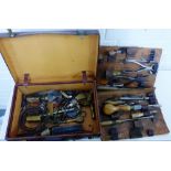 A vintage leather case piano tuners tool kit containing miscellaneous tools etc., (a lot)