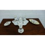 A continental porcelain 'Violets' floral patterned dressing table set, comprising jars, ring tray,