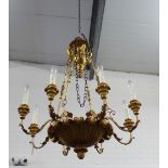 A giltwood eight-branch light fitting with swan neck ceiling rose