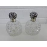 A pair of Victorian silver topped and cut glass globular scent bottles, makers mark for Charles May,