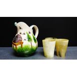 A Griselda Hill Wemyss ware pottery jug with beehive pattern together with three small horn beakers,