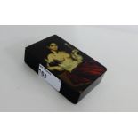 Paper mache snuff box, the hinged lid with female semi clad figure, 10 x 7 cm