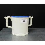 A 19th century pearlware twin handled tankard, the white glazed body with a blue rimmed top with