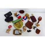 A mixed lot to include animals, vintage purses, ribbons, a compact, small bronze dog, lighter, etc.,