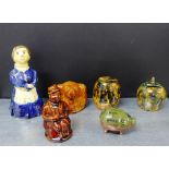 A collection of Scottish pottery money banks to include two Dunmore style, a treacle glazed Souter