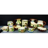 A quantity of Torquay pottery to include cottage patterns, thistle scandy and violets (13)