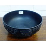 A large Wedgwood black basalt fruit bowl with a procession of three dancing female figures to the