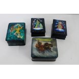 A group of four Russian lacquered rectangular boxes depicting a troika figure and a snow queens,