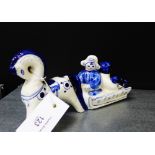 A Russian porcelain blue and white figure of two children on a sledge being pulled by a horse,