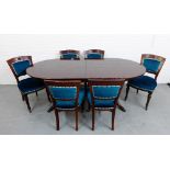 A mahogany dining suite comprising twin pedestal table and set of six chairs with blue upholstered