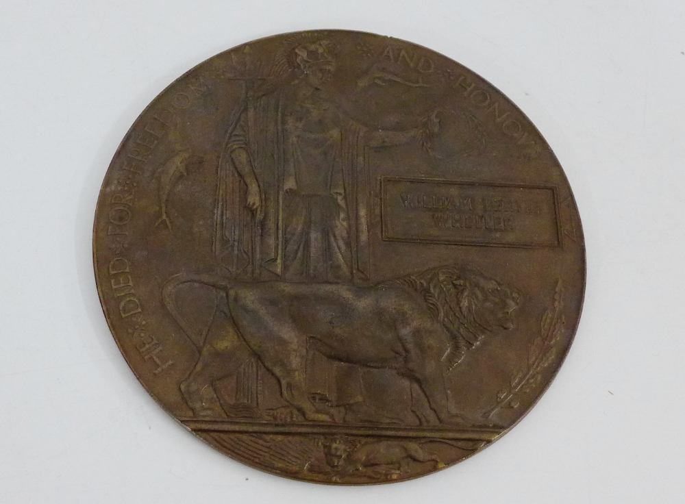 A WWI bronze Death Plaque, awarded to William Bertie Wheller