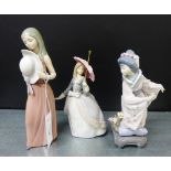 A collection of three Lladro porcelain figures to include a Geisha girl, a girl with parasol and