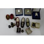 A collection of 19th century and later thimbles to include silver examples, three Royal Worcester