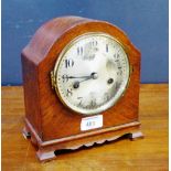 A mantle clock with a silvered dial and Arabic numerals, 21cm high