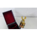 A miniature white metal and gilt metal miniature Russian helmet in a fitted box, 8.5cm high