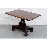 A mahogany side table, the rectangular top on lyre support and quadripite base with bun feet and