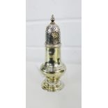 A George III silver sugar castor, the detachable pierced top with a baluster finial, bearing