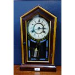 An American faux rosewood cased mantle clock, 45 x 28cm