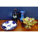 A mixed lot to include a blue lustre vase, a black glazed vase, a Portuguese leaf moulded comport