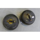 Two early 20th century curling stones with brass and ebonised handles (2)